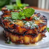 Sweet grilled pineapple dessert glistening with melted yuzu kosho butter and a touch of salt.
