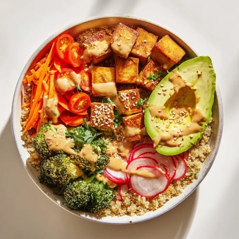 Steamed broccoli and crisp veggies top a bed of quinoa in this nourishing Buddha bowl.